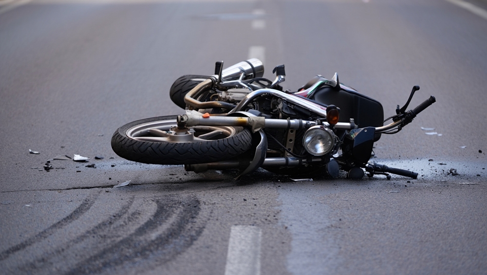 Damaged motorcycle lying on the road after a crash in Mountain View